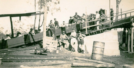 Miners in coal trucks